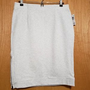 Light grey knee length pencil skirt.